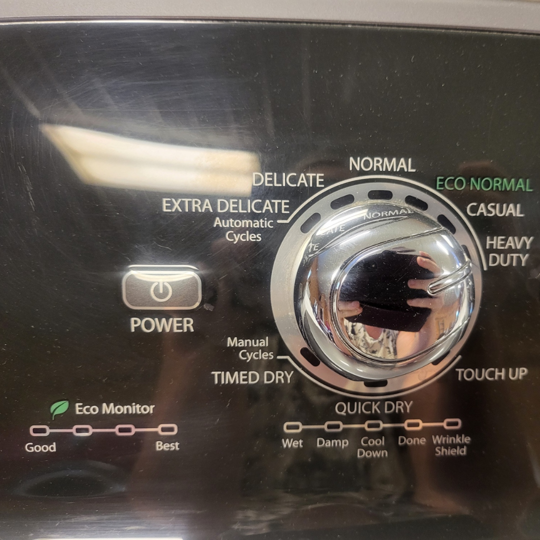 Control panel of a dryer with various settings and indicators.