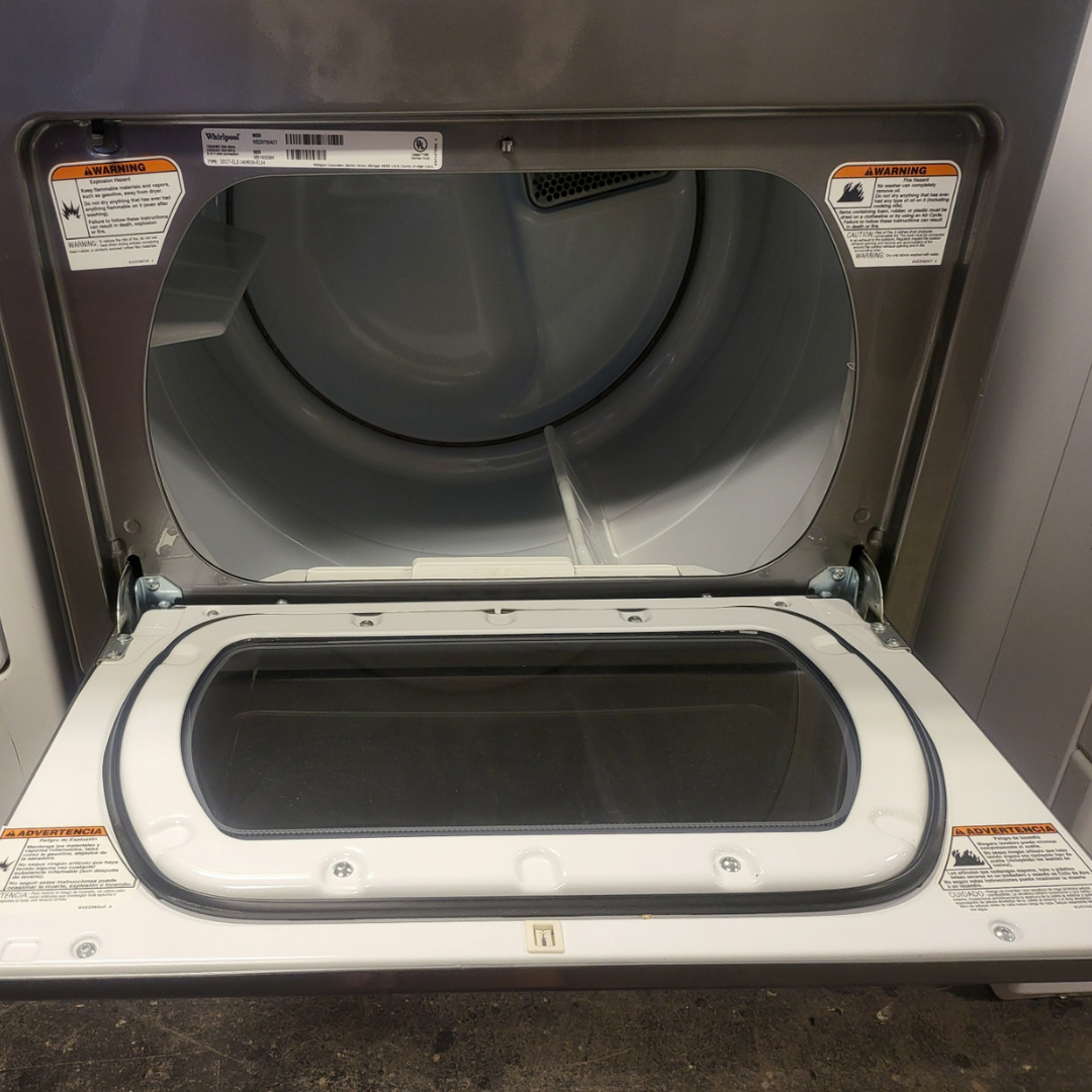 Open dryer door with interior view of a dryer